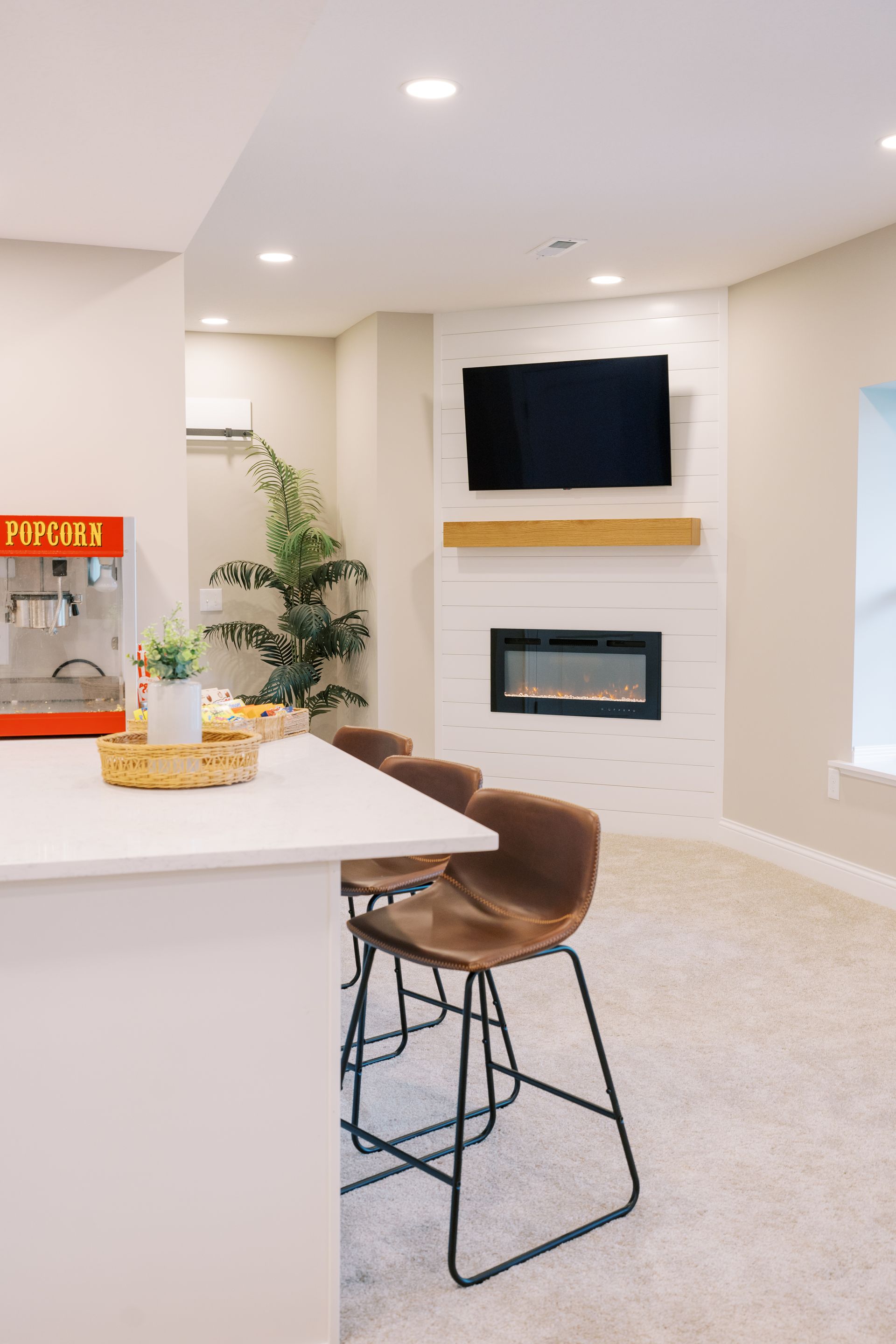 There is a popcorn machine in the middle of the room.