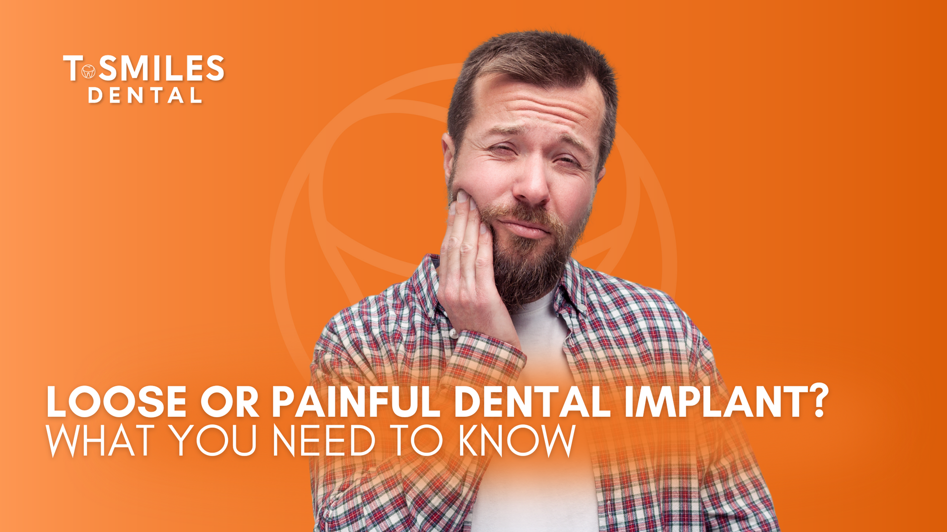 A man with a beard is holding his mouth in pain.