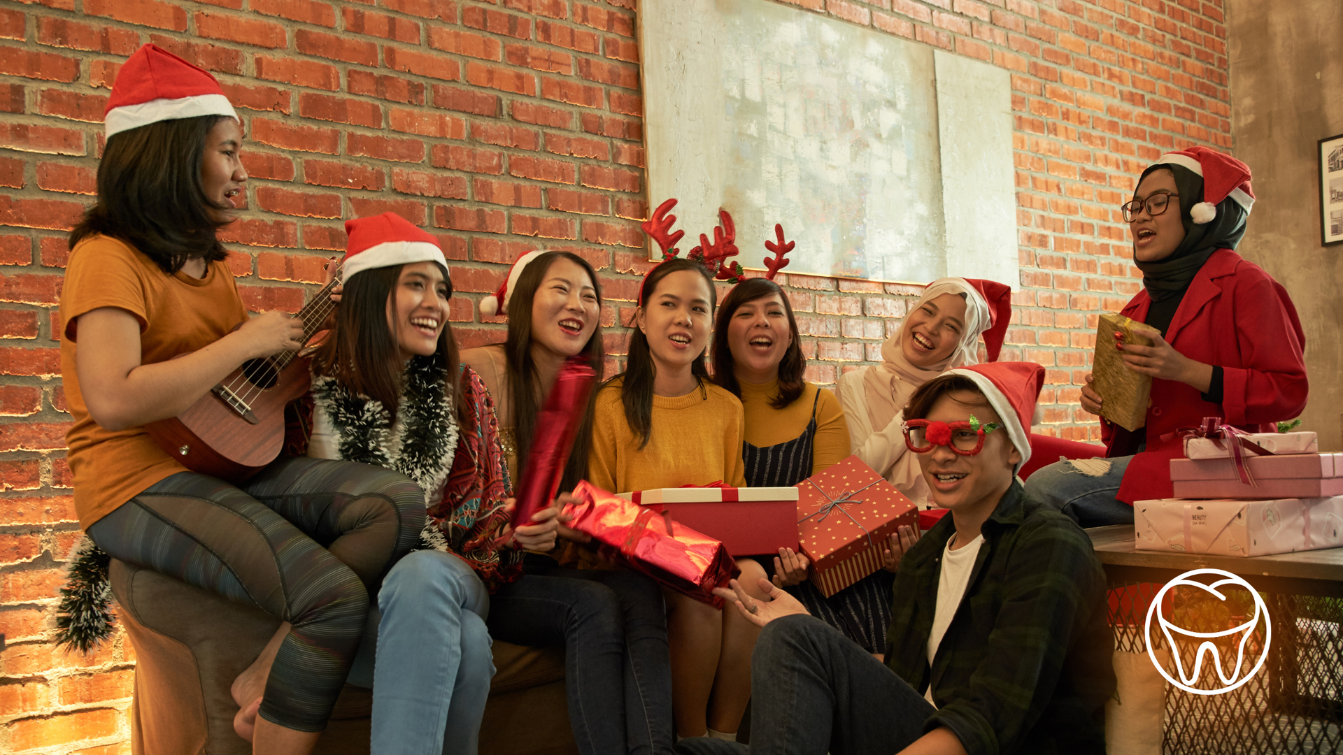 A group of people are celebrating christmas together.