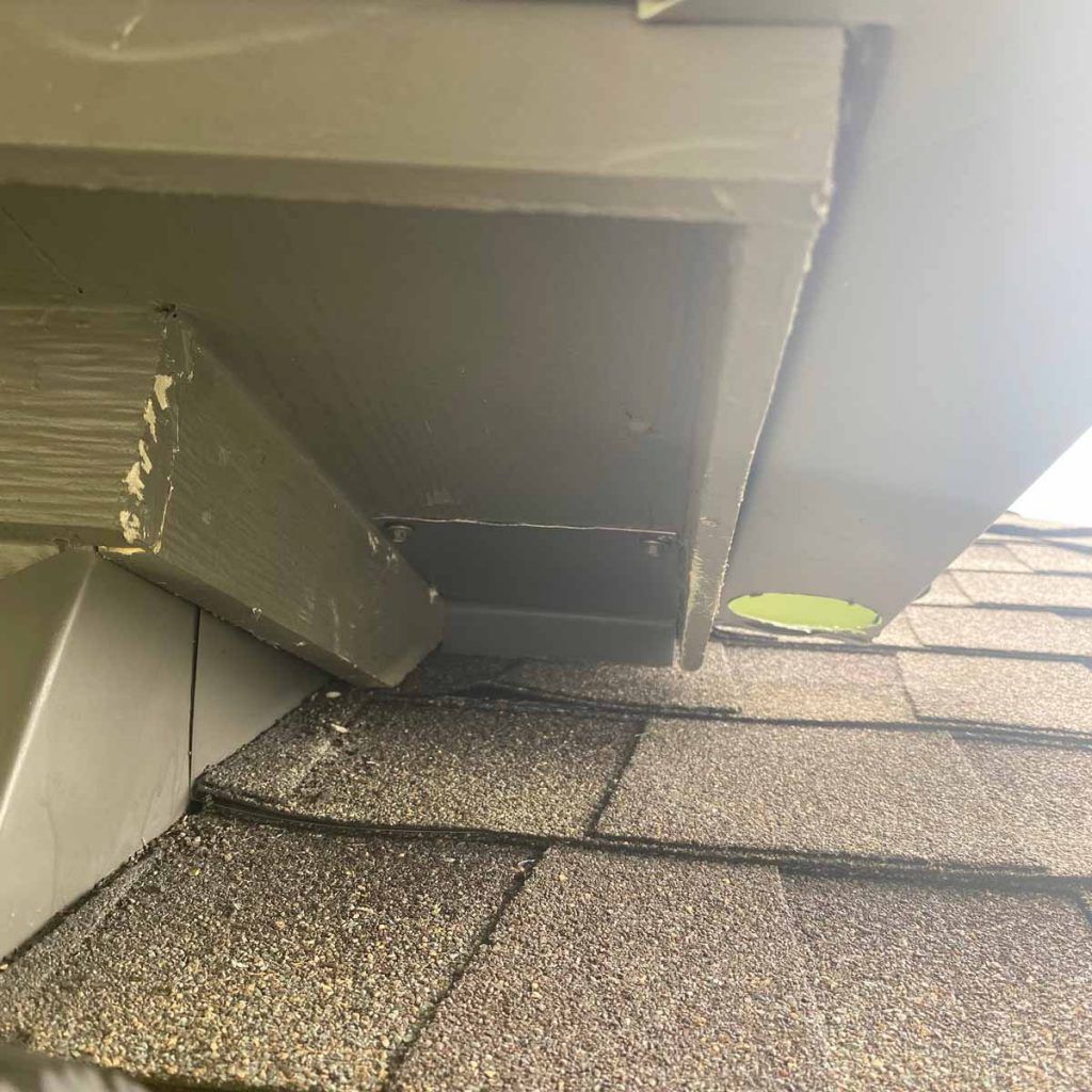 A close up of a roof with a hole in it.