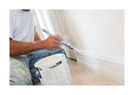 New West Painting Employee Painting white baseboard