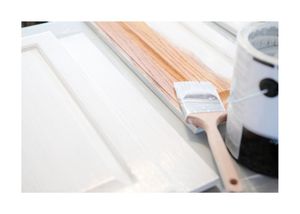 New Westminster Painting redoing cabinet doors with white paint