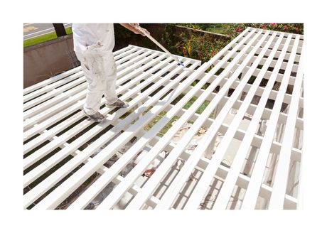 New West Painting Employee painting white lattice with extendable roller
