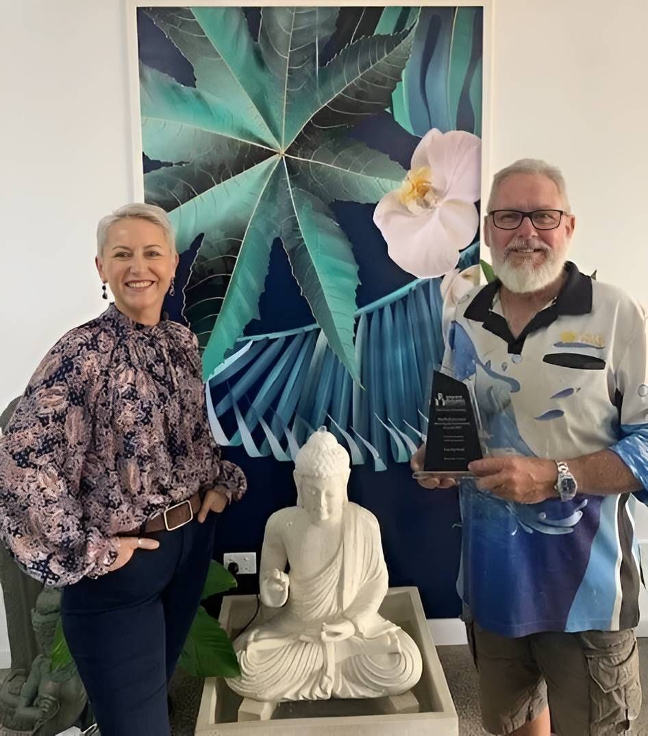 Two Person and Sculpture Posing for a Picture Together — Sun City Pools In Hyde Park, QLD