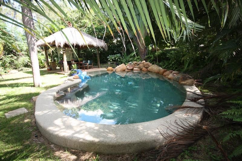 A Swimming Pool With a Gazebo in the Background — Sun City Pools In Hyde Park, QLD