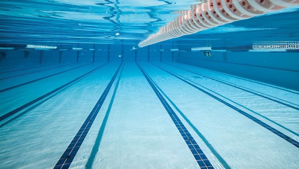 An Empty Swimming Pool is Shown From Underwater — Sun City Pools In Hyde Park, QLD
