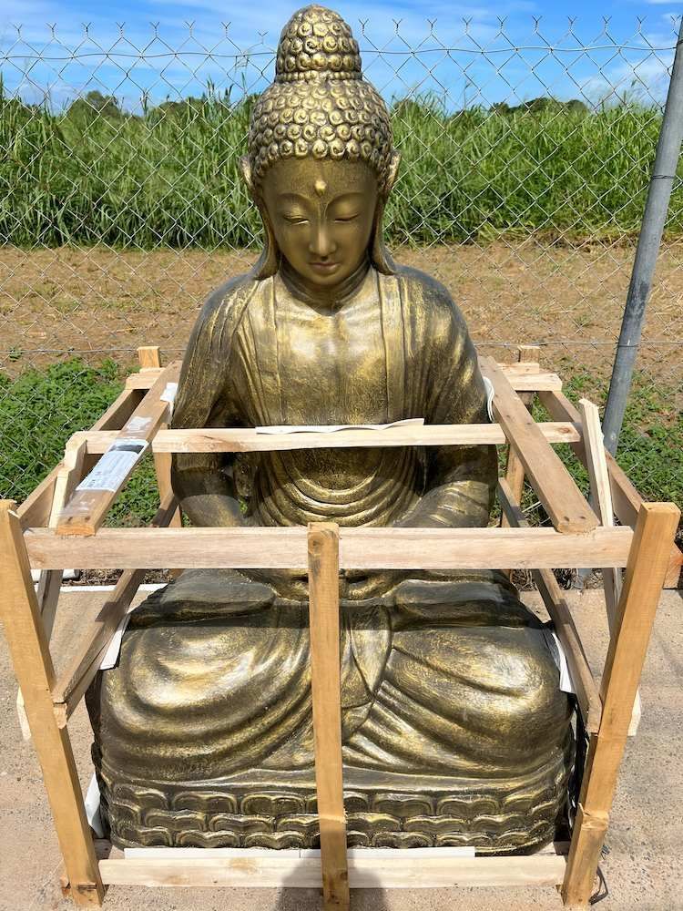 A Sculpture Inside the Wood Sitting on the Floor — Sun City Pools In Hyde Park, QLD