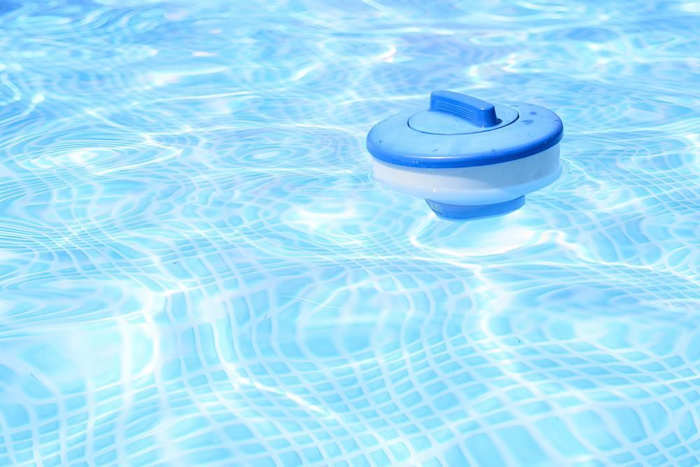 A Blue and White Device is Floating in a Swimming Pool — Sun City Pools In Hyde Park, QLD