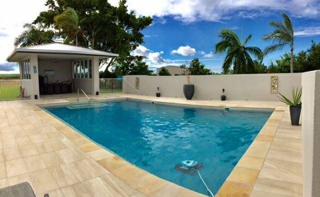 A Large Swimming Pool With a Gazebo in the Background — Sun City Pools In Hyde Park, QLD