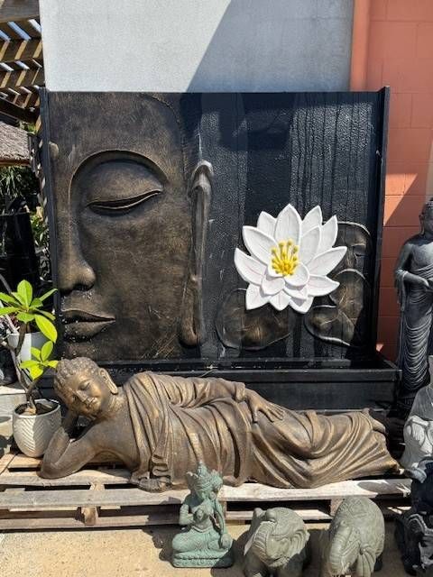 A Buddha Face with White Lotus Flower Fountain — Sun City Pools In Hyde Park, QLD