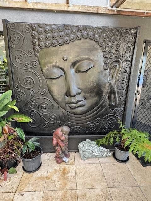 A Buddha Face Wall Fountain— Sun City Pools In Hyde Park, QLD