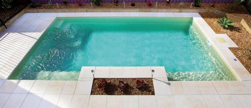 A Large Square Swimming Pool With Steps Leading to It — Sun City Pools In Hyde Park, QLD