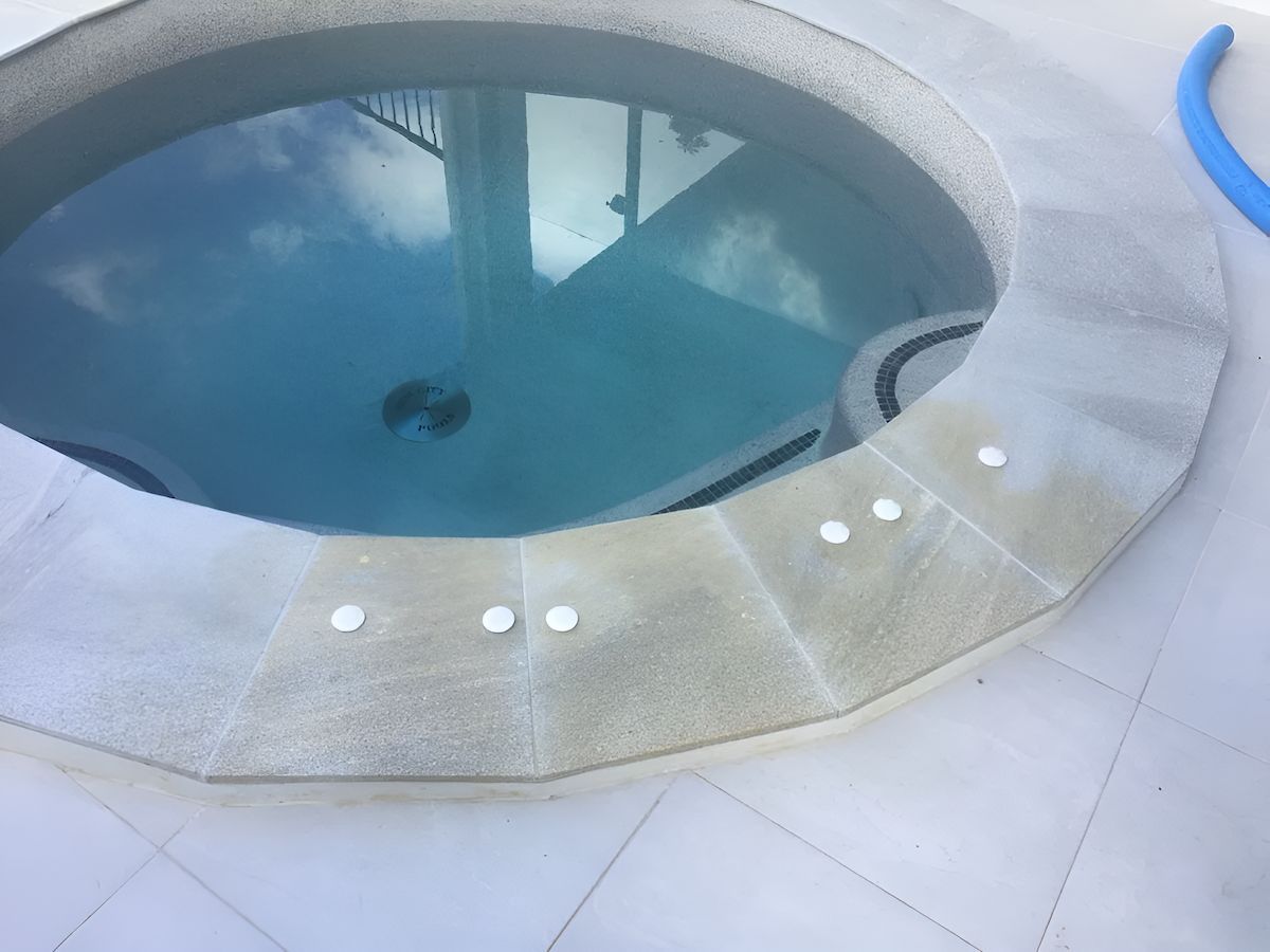 A Round Swimming Pool With a Blue Sky Reflected in It — Sun City Pools In Hyde Park, QLD