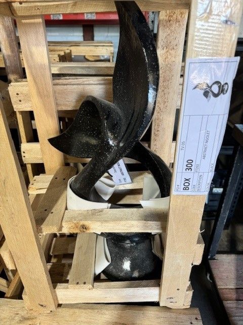 A Sculpture in a Wooden Crate With a Label — Sun City Pools In Hyde Park, QLD