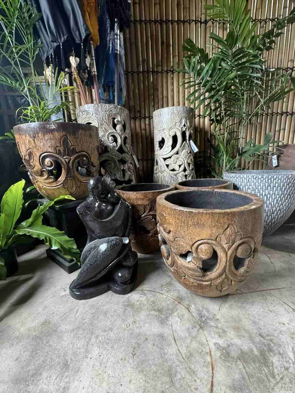 A Group of Pots and Planters Sitting on Top of a Table — Sun City Pools In Hyde Park, QLD