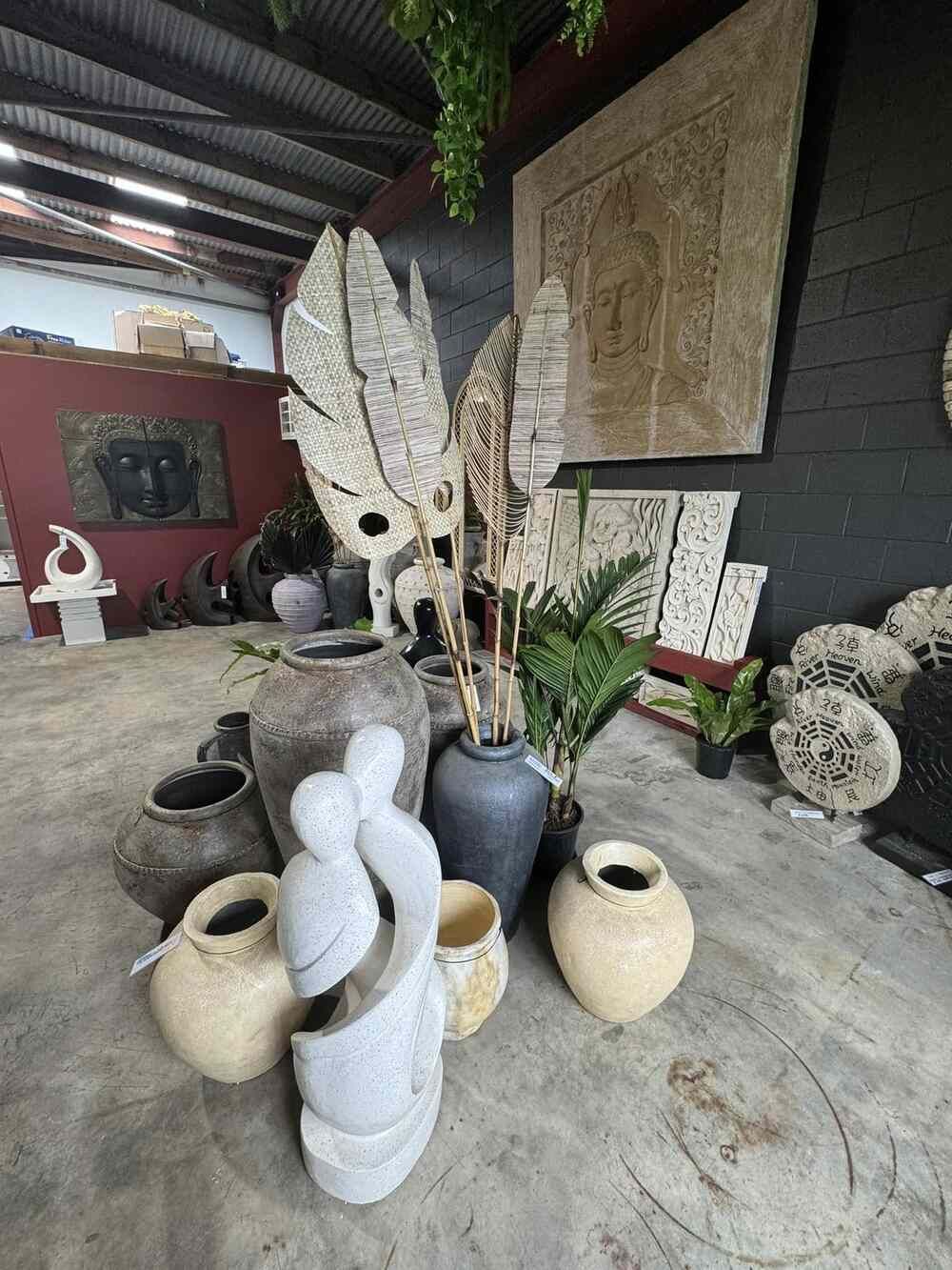 A Room Filled With Lots of Vases and Sculptures — Sun City Pools In Hyde Park, QLD
