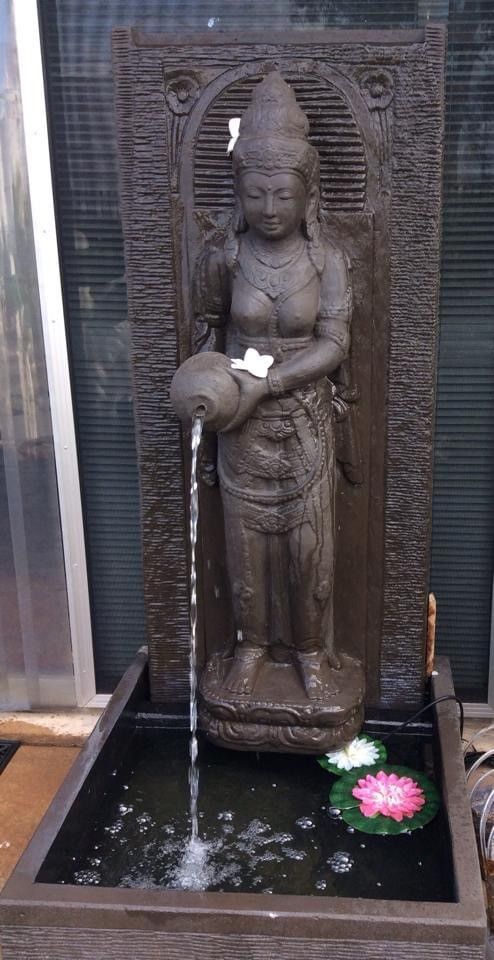 A Statue of a Woman Pouring Water Into a Pond — Sun City Pools In Hyde Park, QLD