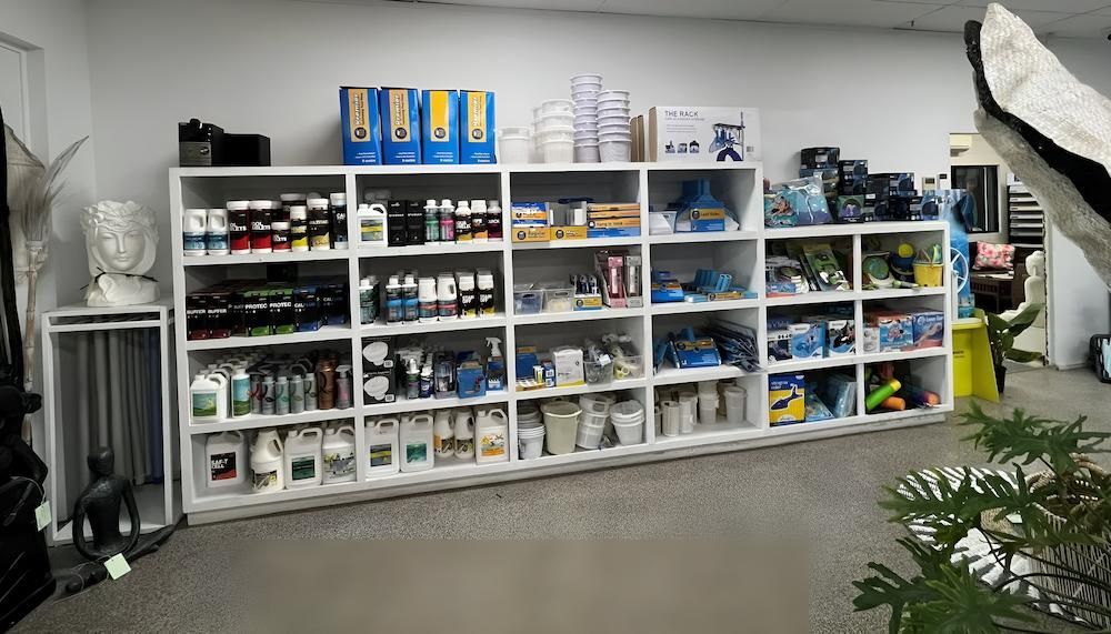 A Room Filled With Shelves Filled With Lots of Different Items — Sun City Pools In Hyde Park, QLD