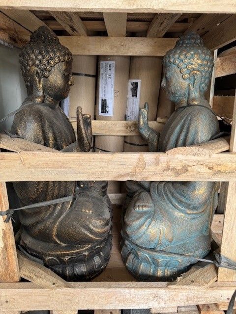 A Group of Statues Are Sitting Next to a Pond in a Garden — Sun City Pools In Hyde Park, QLD