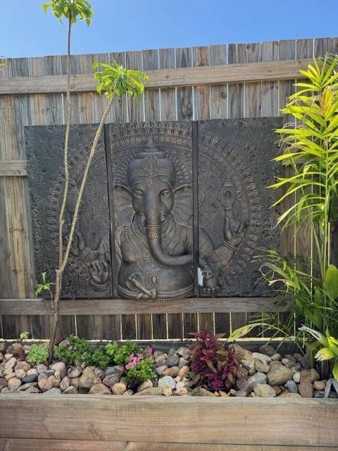 A Group of Potted Plants Sitting Next to Each Other on a Sidewalk — Sun City Pools In Hyde Park, QLD