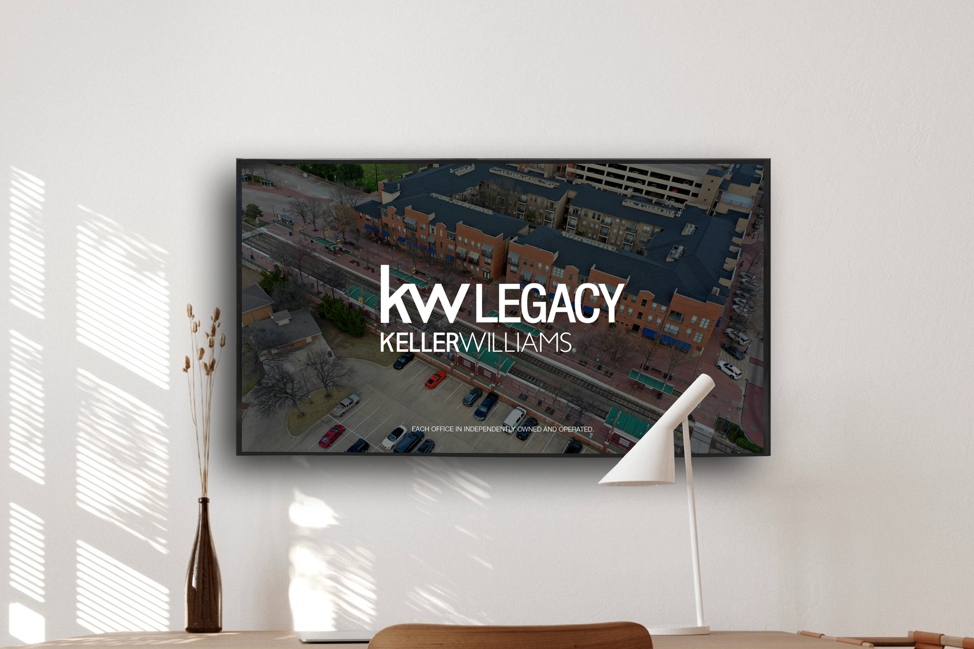 A flat screen tv is hanging on a wall in a living room.