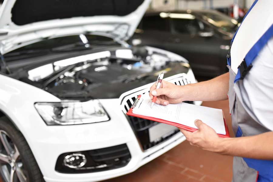 Man inspecting a car —  Car Rental in Kingston,NY