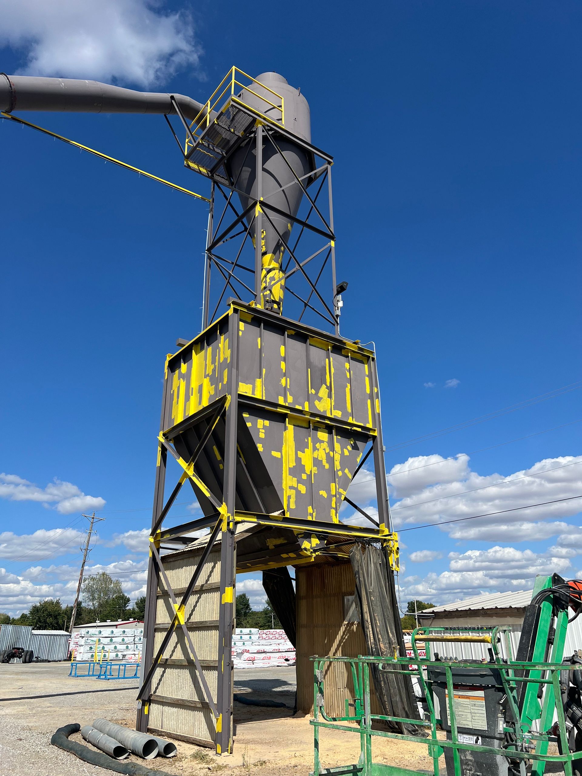 A large metal structure with yellow paint on it