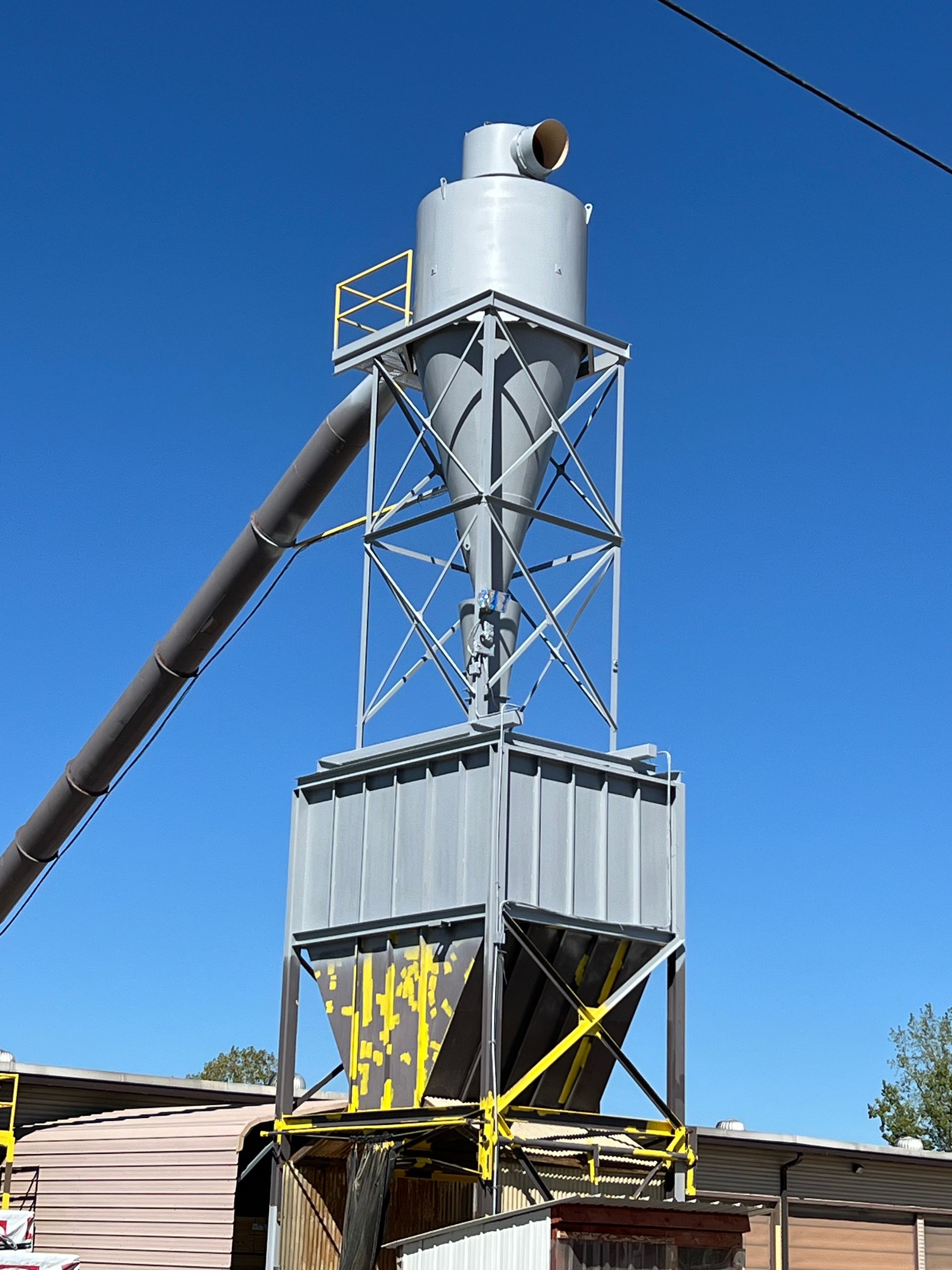 A large metal structure with a blue sky in the background
