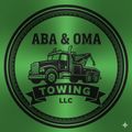 Green circular logo for ABA & OMA Towing LLC, featuring a tow truck and company name.