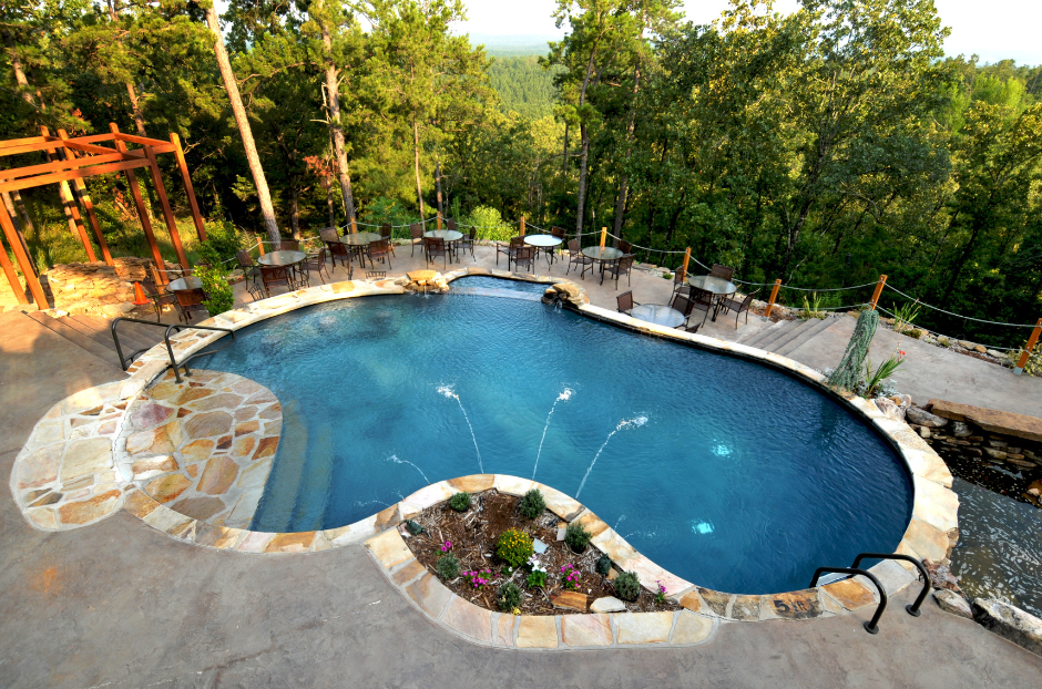 A picture of a pool with trees around it.