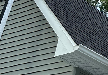 Roofing Maintenance — Roofer Checking Roof and Gutter in Syracuse, IN