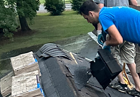 Roofing Contractors — Roofer Repairing Shingles Roof in Syracuse, IN