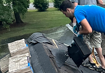 Roofing Repair — Roofer Repairing Roof in Syracuse, IN