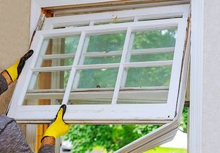 Window Installation Service — Man Installing Window in Syracuse, IN