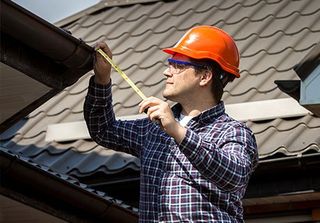 Roofing Inspection — Roofer Doing Inspection on Roof in Syracuse, IN