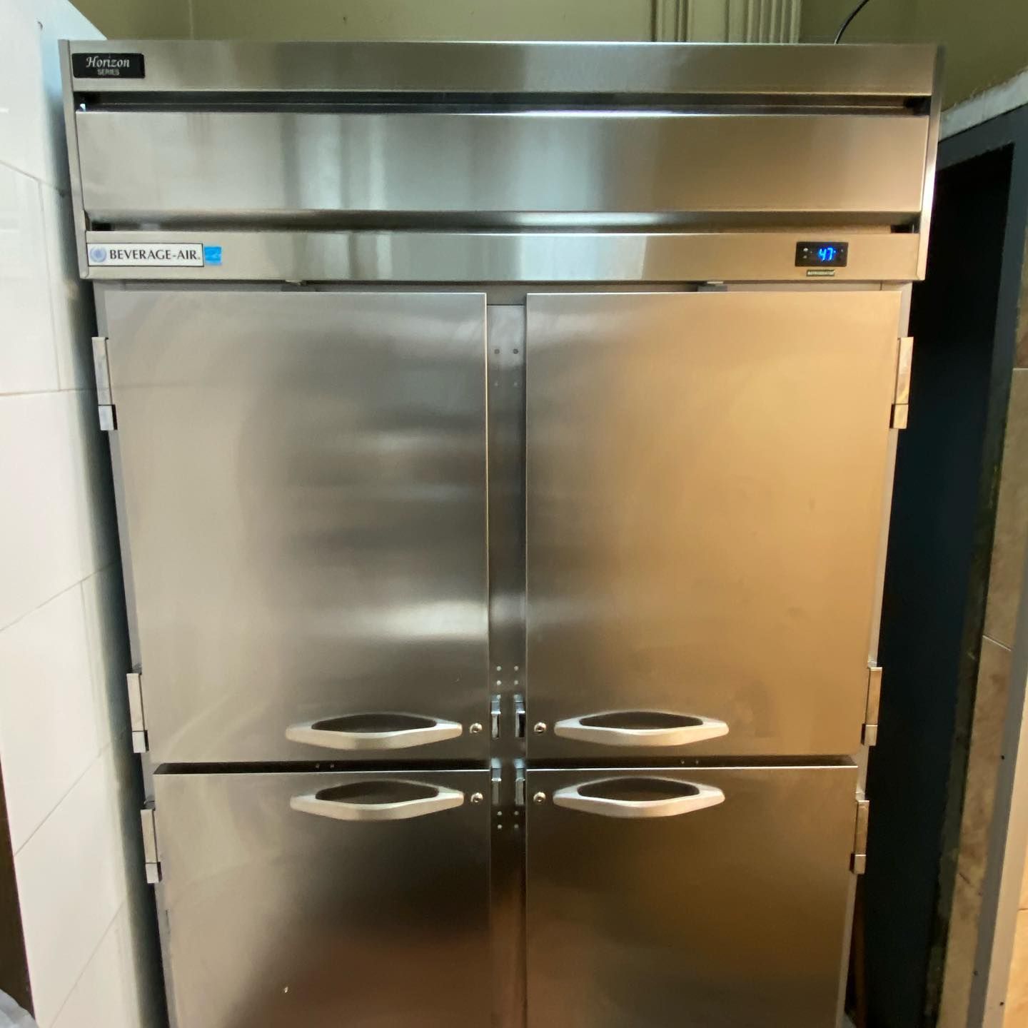 A large stainless steel refrigerator with four doors