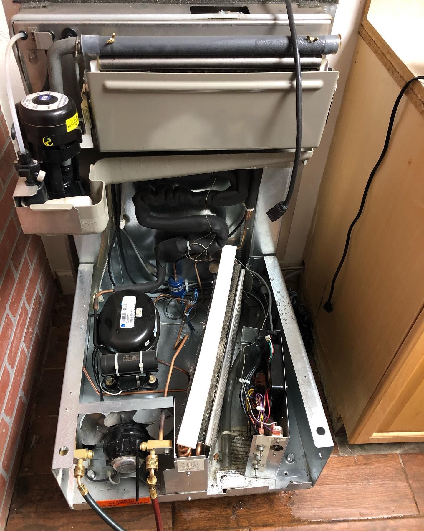 The inside of a refrigerator is shown with the door open.