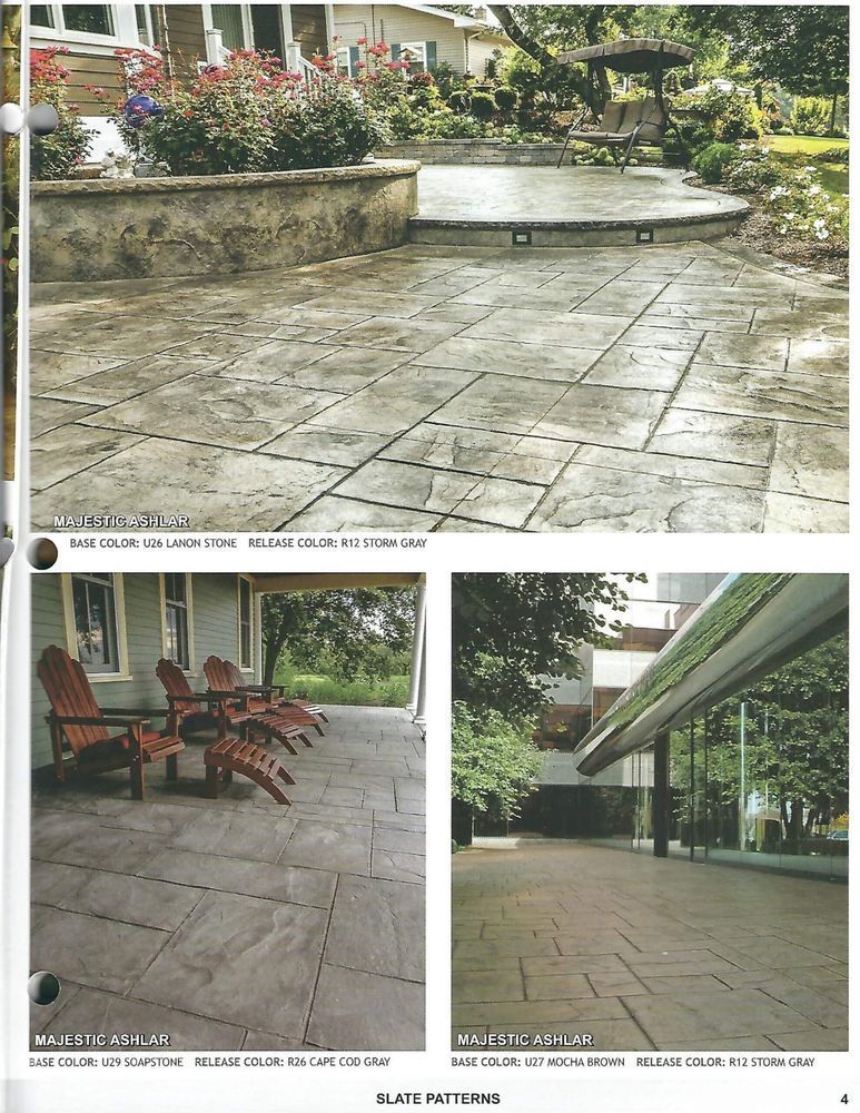 A picture of a patio with chairs and a house in the background