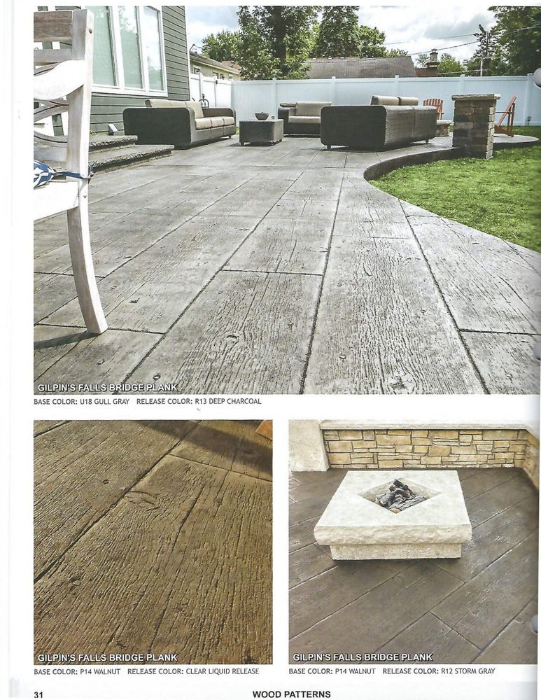 A concrete patio with a fire pit in the middle of it