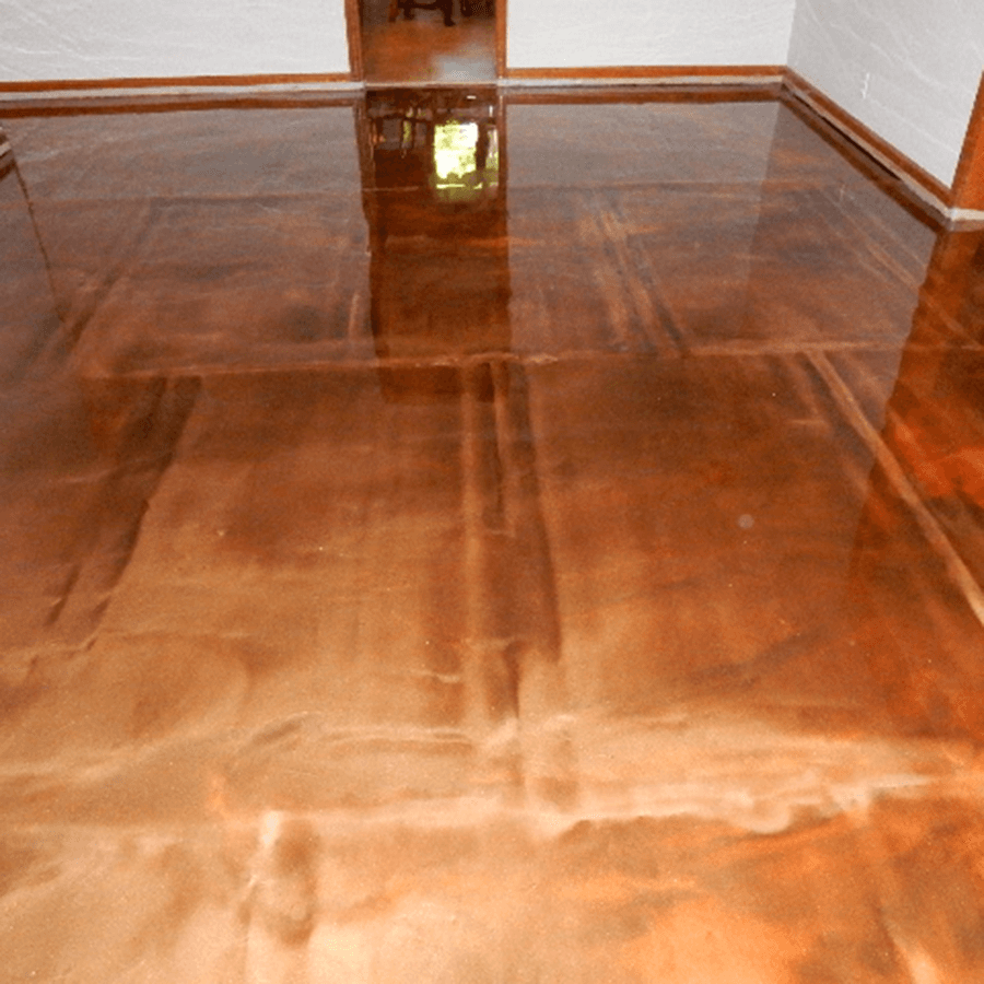 A copper colored floor in a room with a doorway