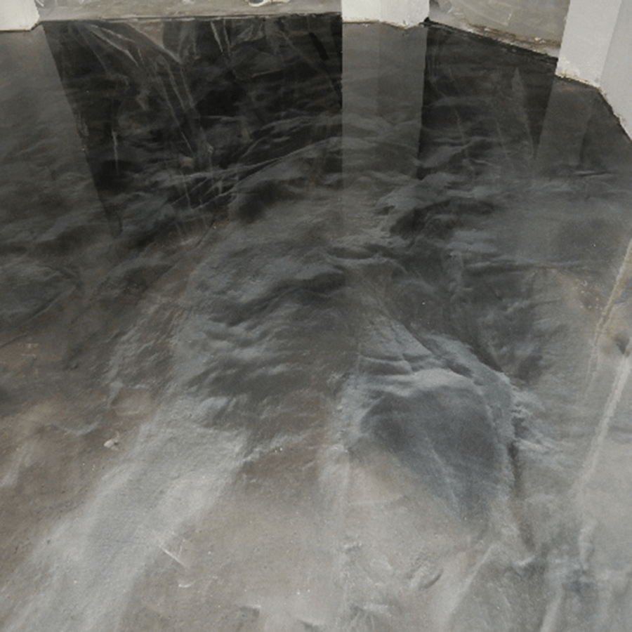 A close up of a metallic floor in a room.