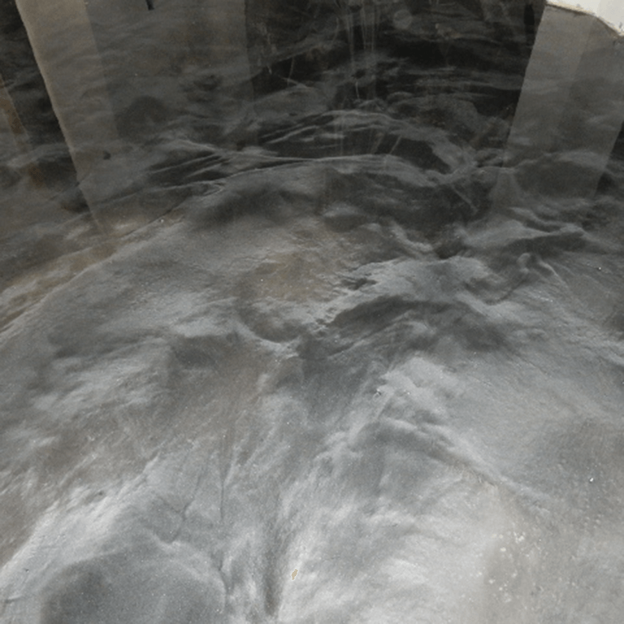 A close up of a black and white metallic floor.