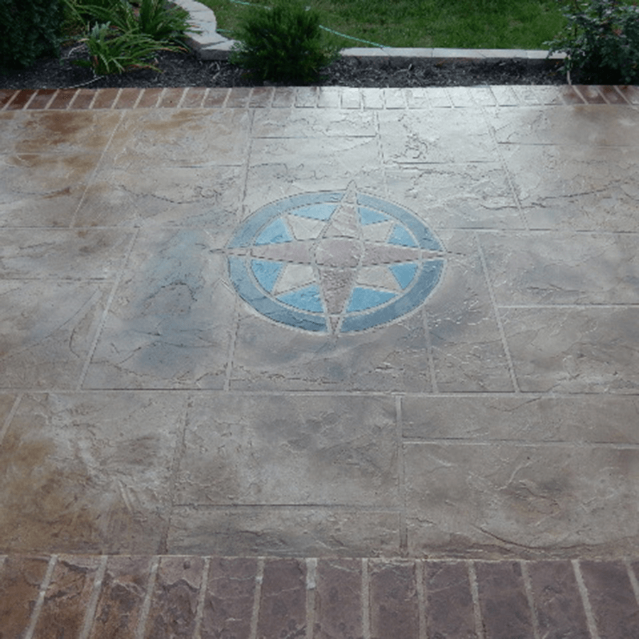 A decorative concrete floor with a blue compass on it
