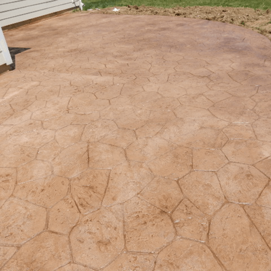 A decorative concrete patio with a hexagonal pattern on it
