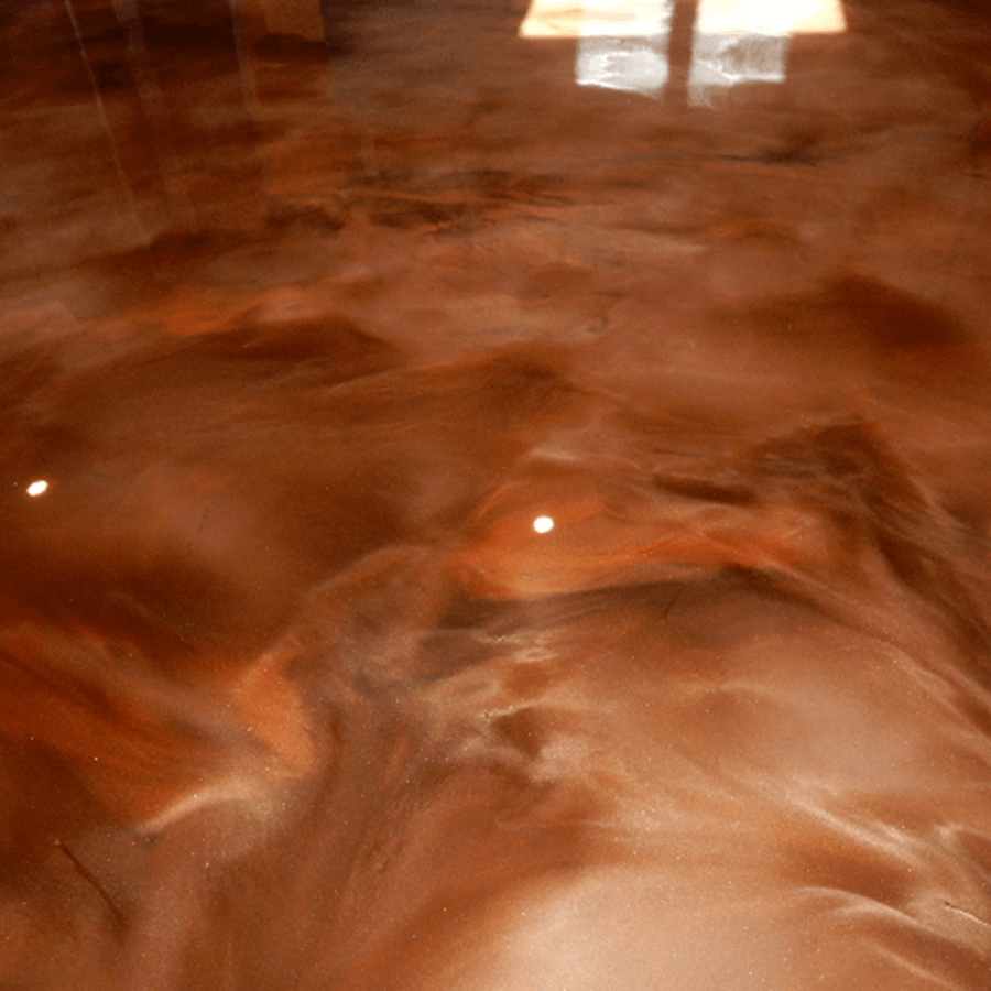 A close up of a brown metallic floor in a room.