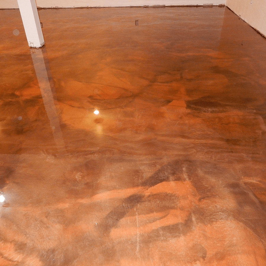 A close up of a shiny metallic floor in a room.