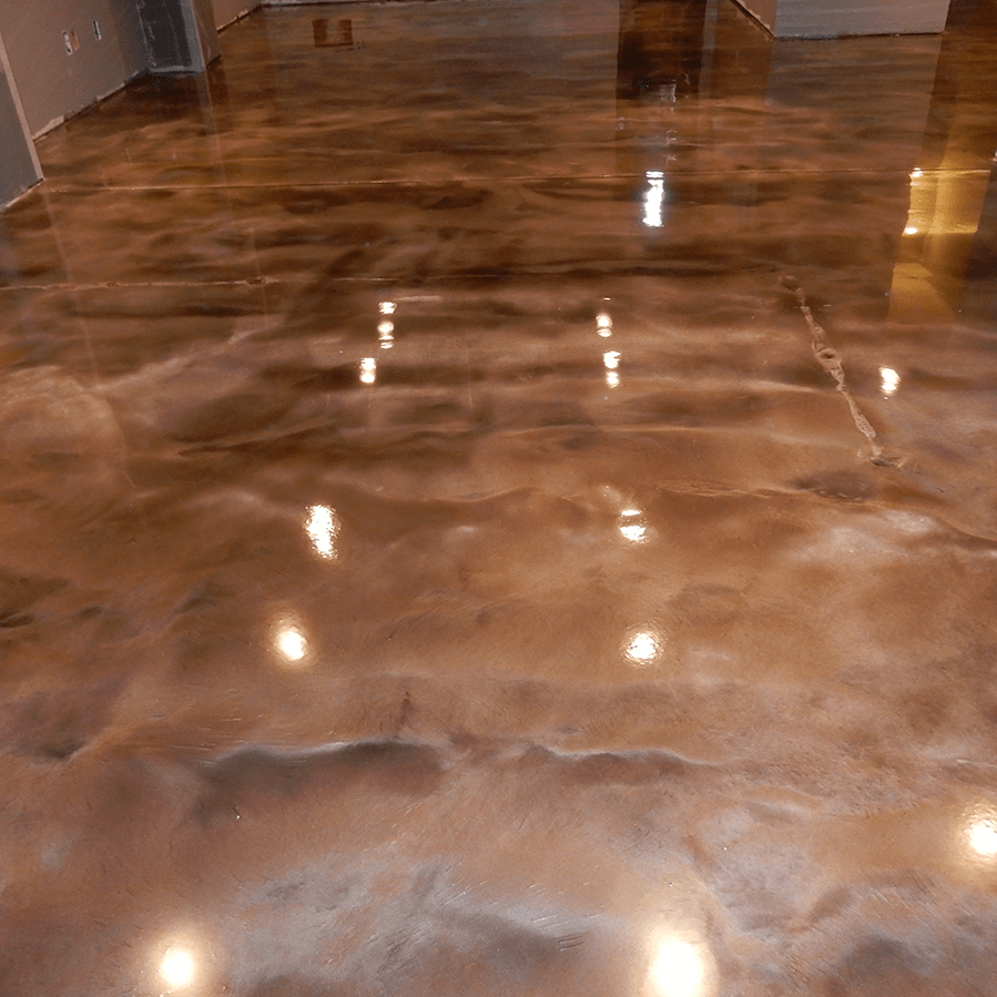 A close up of a shiny metallic floor in a room.