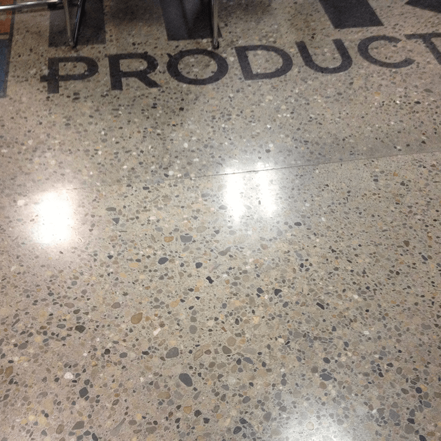 A concrete floor with the word product written on it