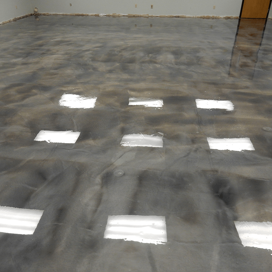A shiny gray floor with a lot of square reflections on it