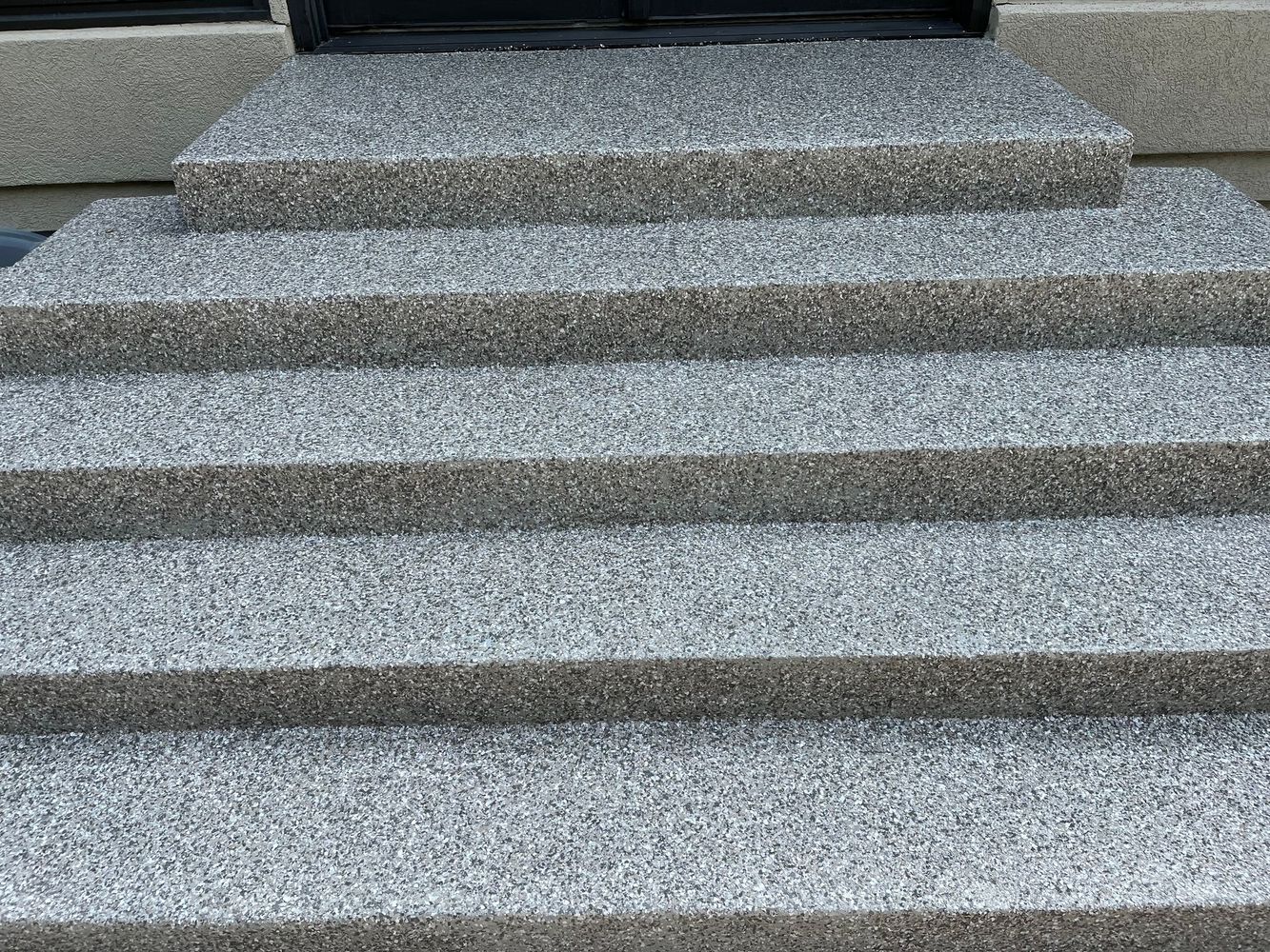 A close up of a set of stairs made of concrete.